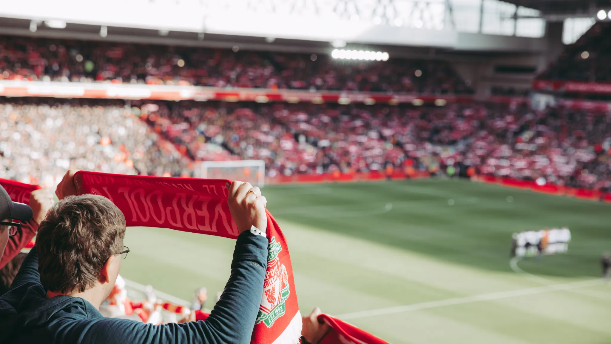 Liverpool stadium under lights, symbolising UEFA’s circular economy goals and sustainability in sport.